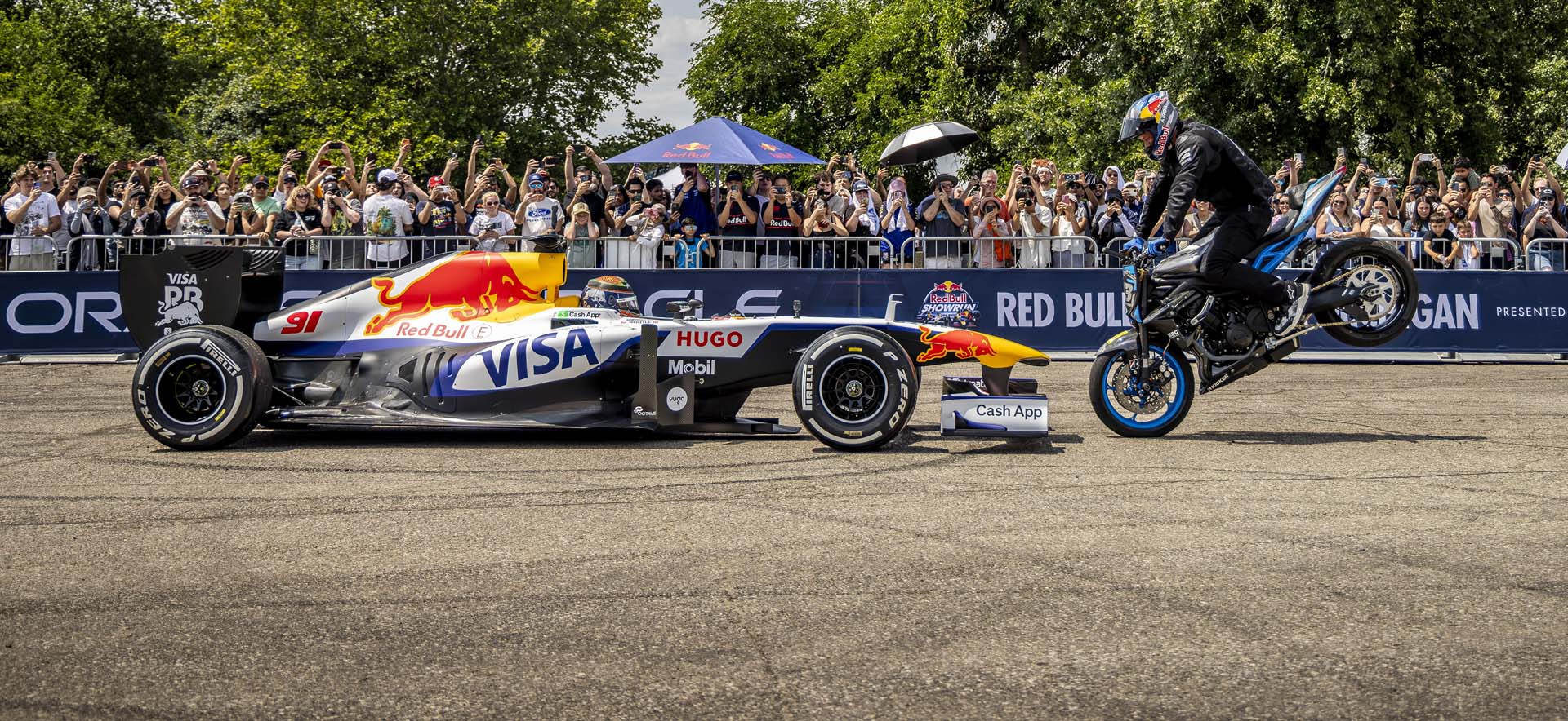 F1 car with motorbike behind