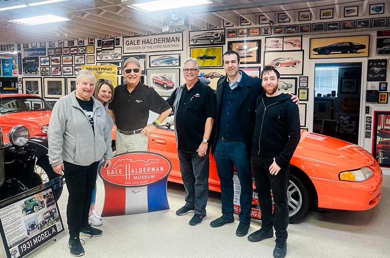 People standing for a photo with cut out of a man