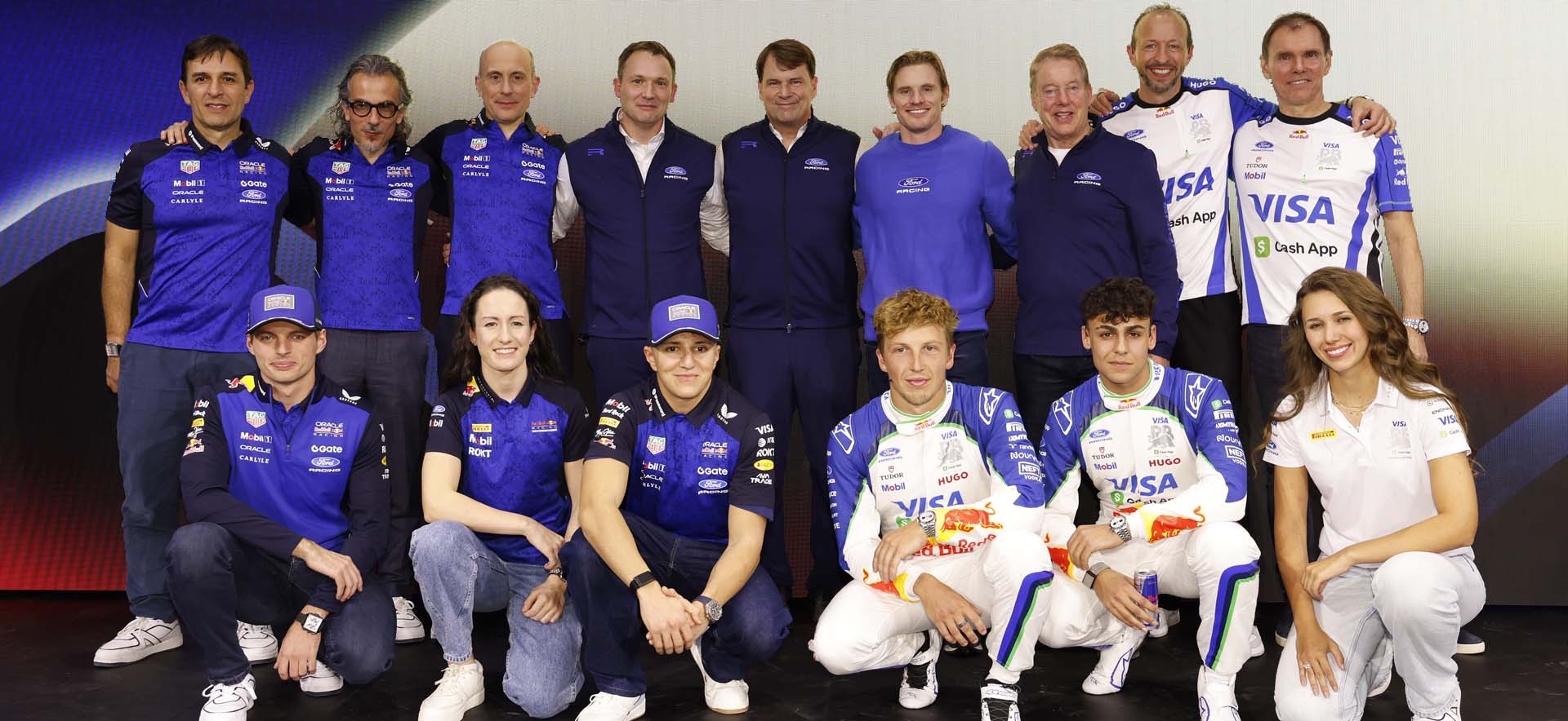 Team on stage with vehicle 