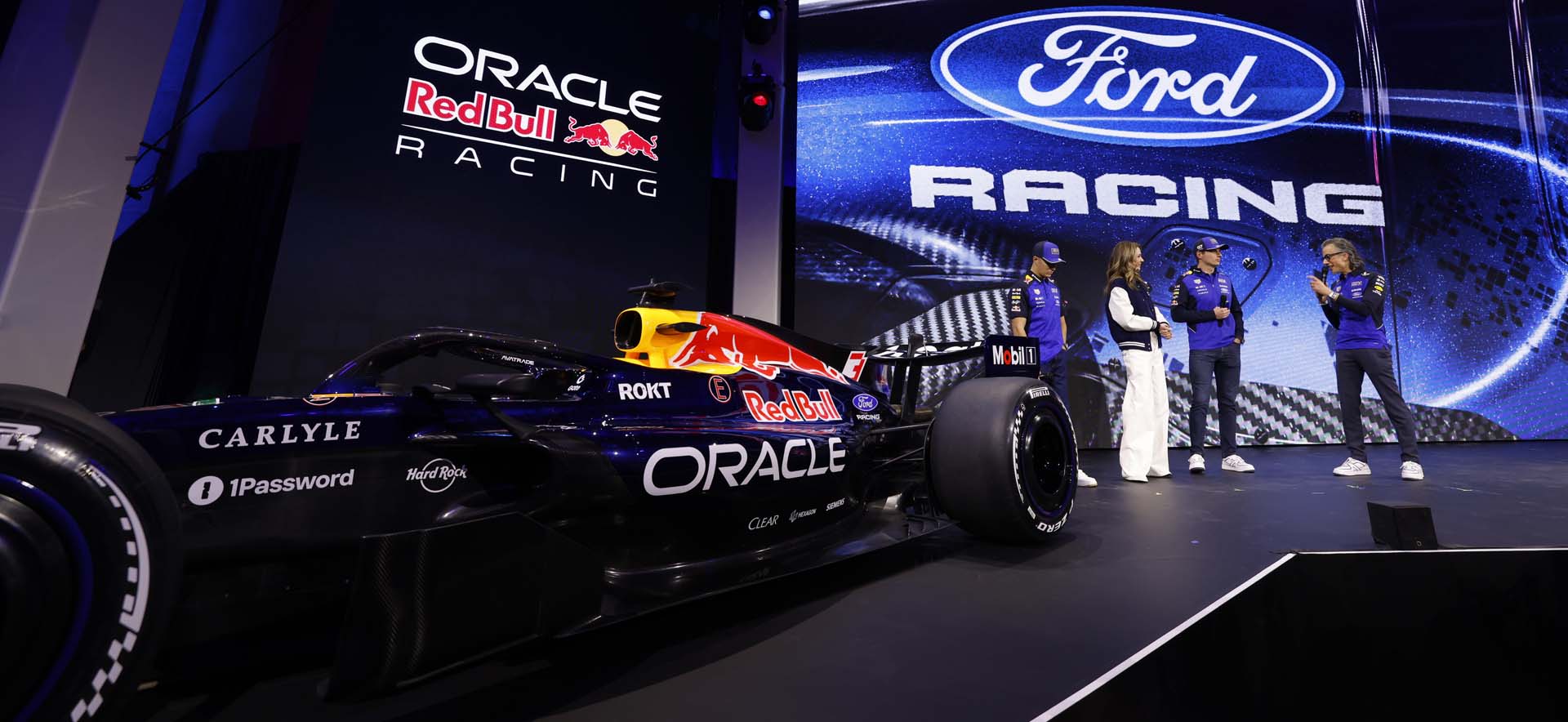 Team on stage with vehicle 