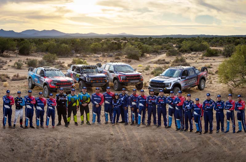 Teams in front of vehicles