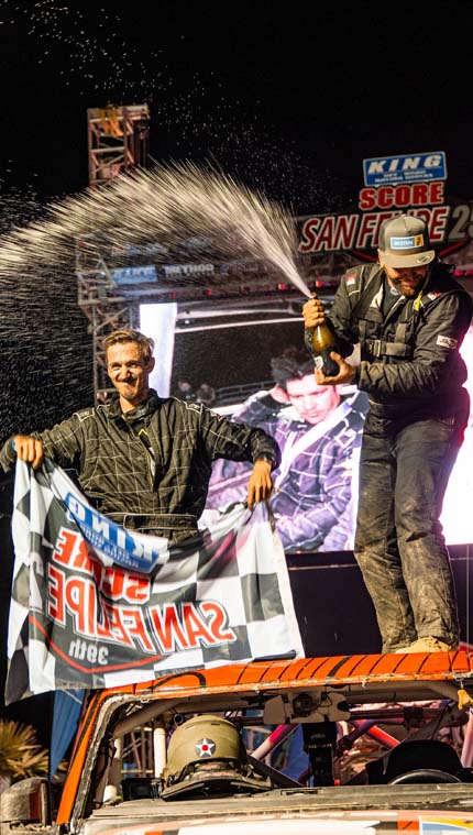 Drivers on car on podium