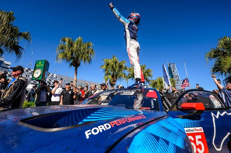 driver celebrating in victory lane