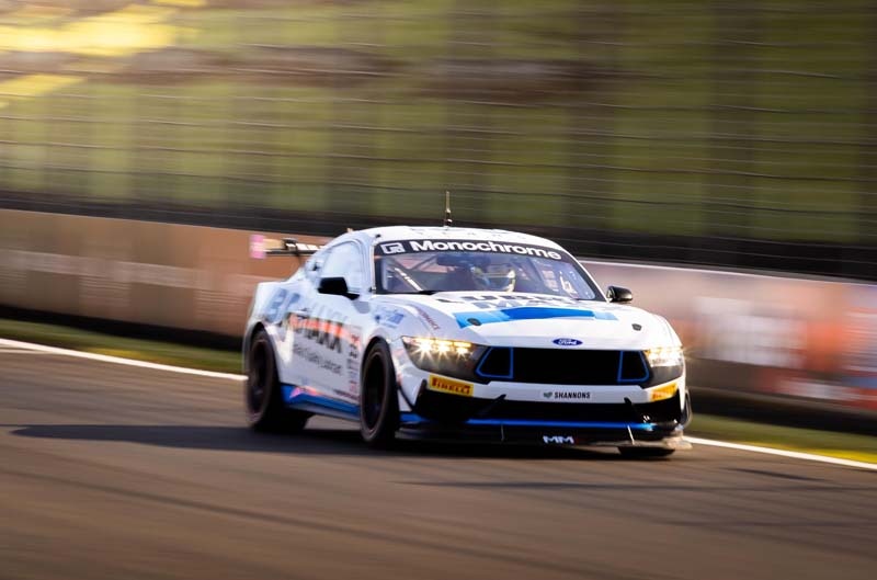 Drivers posing on car
