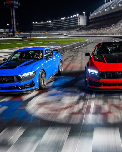 Blue race car and red one on the racetrack
