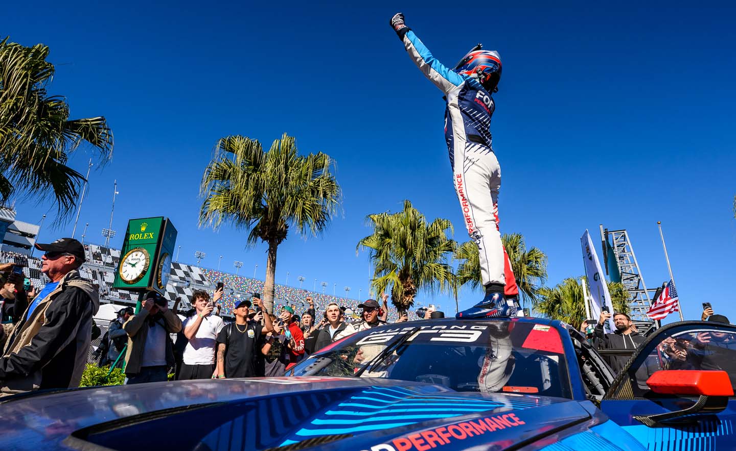 driver in victory lane on car