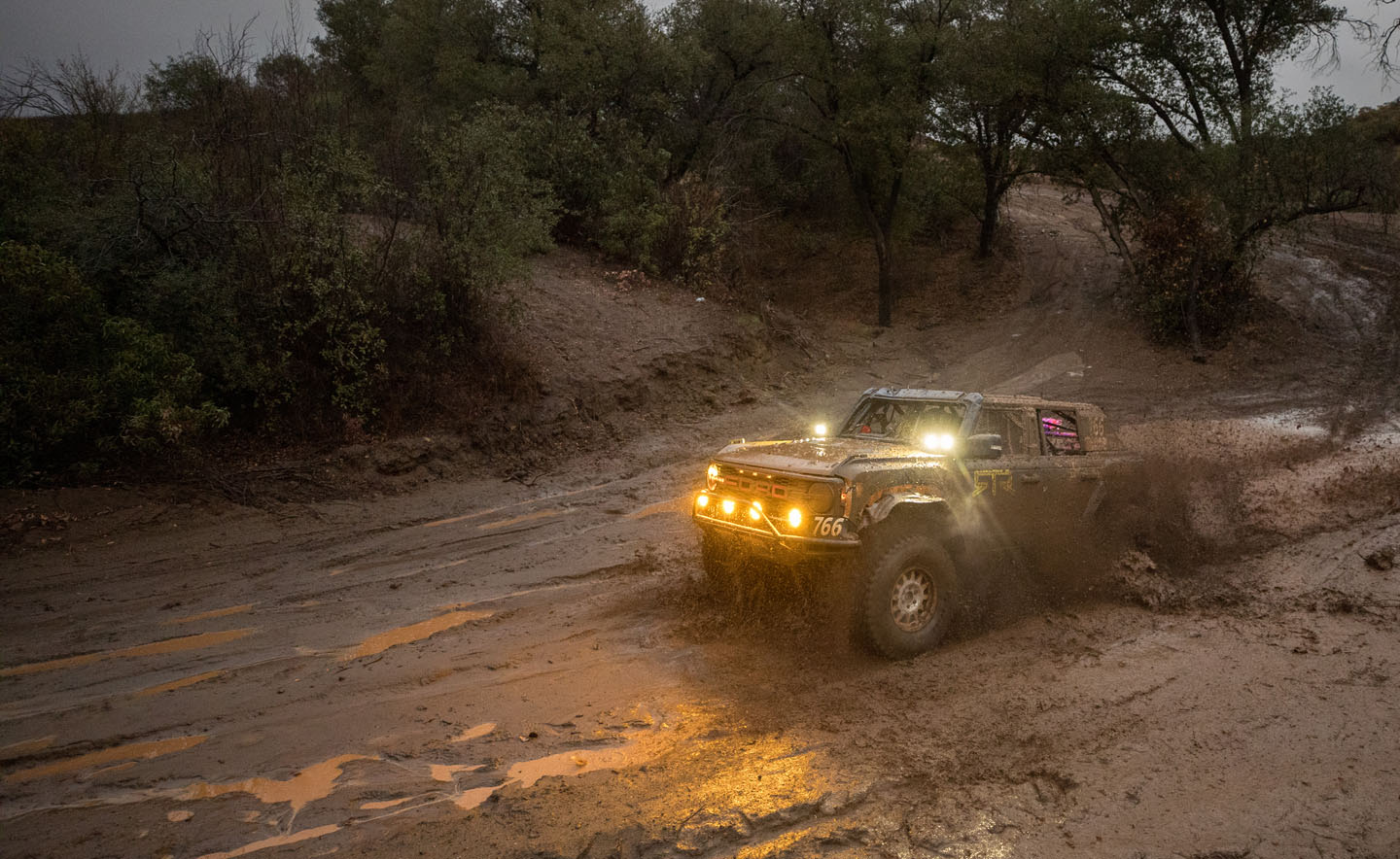 Bronco Raptor driving through mud