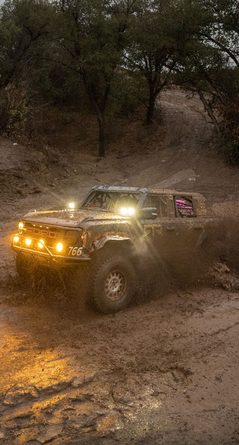 Bronco Raptor driving through mud