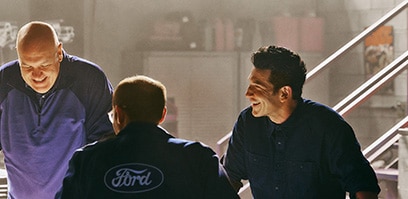 Jon Bernthal and the engineers standing around a table
