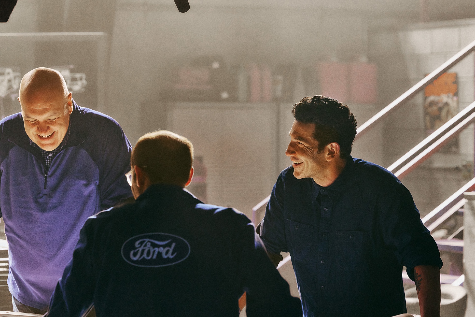 Jon Bernthal and the engineers standing around a table