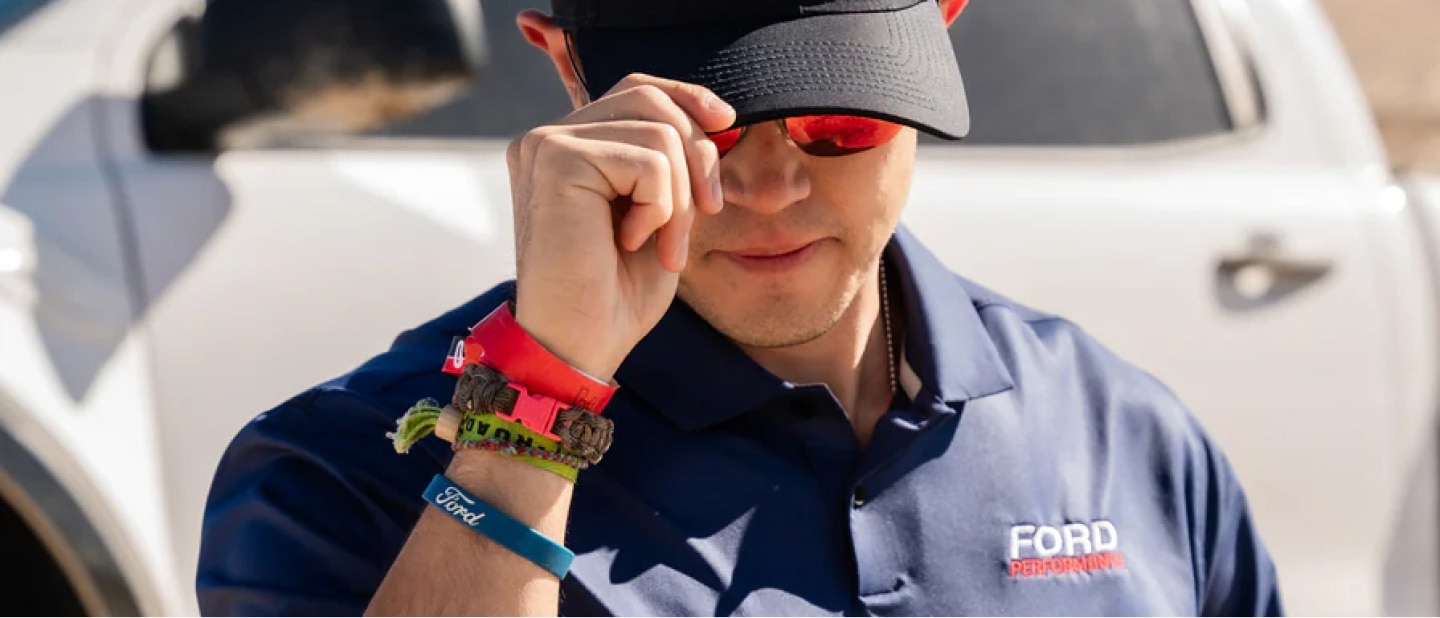 Man tugging on his Ford Performance cap