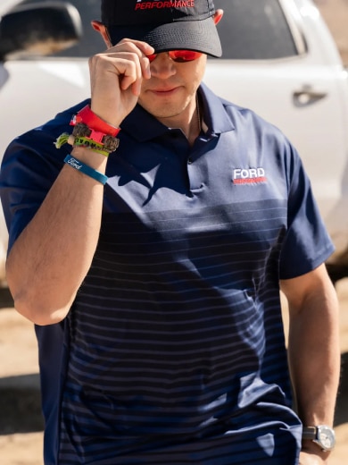 Man tugging on his Ford Performance cap