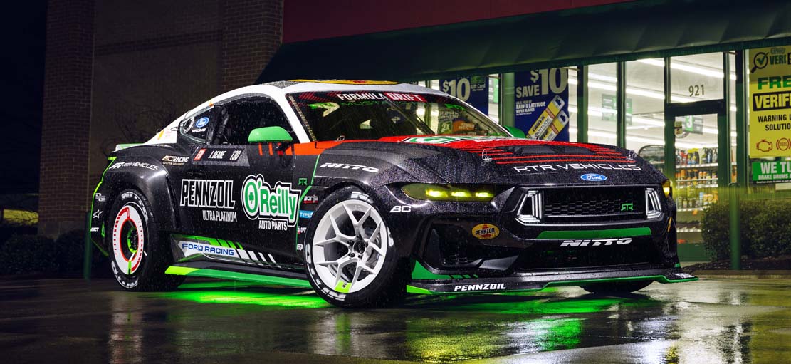 Race car in motion with smoke emerging from rear