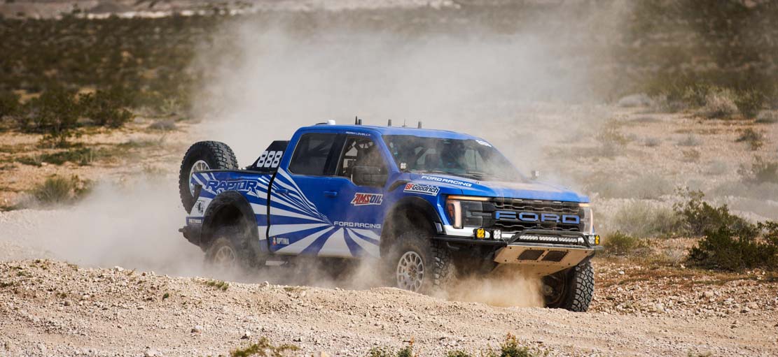 Race car in motion splashing in water