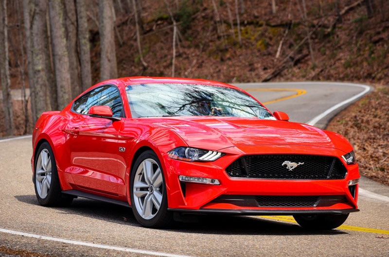 red Mustang on the road