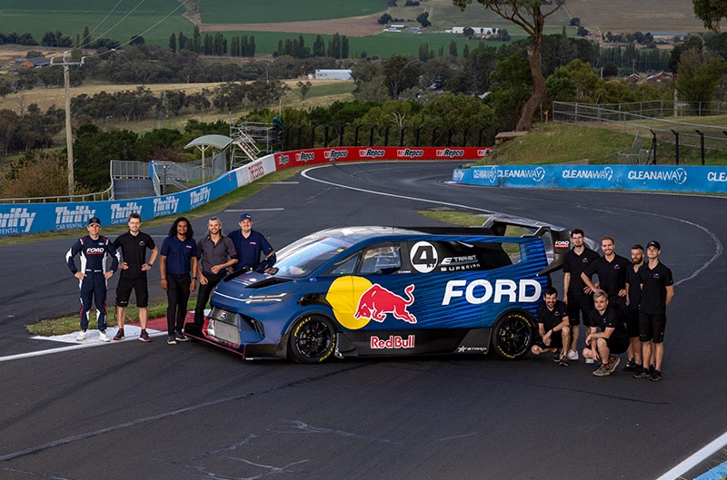 STARD Team and Ford Marketing team standing with SuperVan 4.2 on track