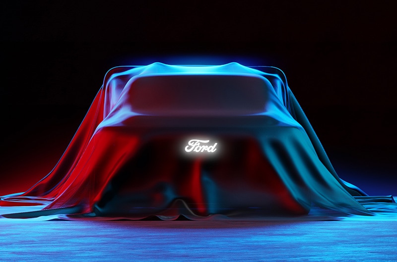 Ford Lightning EV Demonstrator Vehicle under a sheet with Ford logo on front