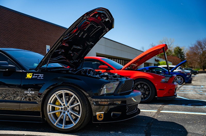Ford mustangs parked in lots