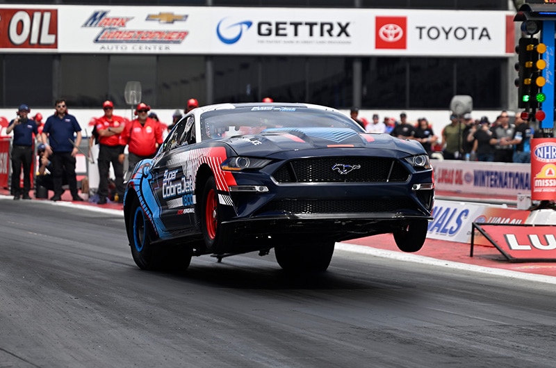 Mustang Super Cobra Jet 1800 with front wheels in the air at Pomona Drag Strip