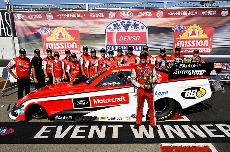 Tasca and team with Mustang and trophy