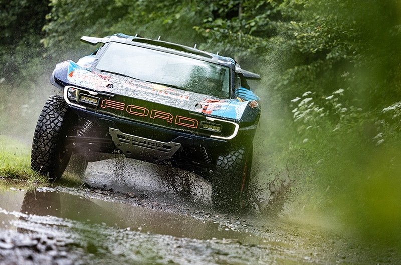 Ford Raptor driving through mud