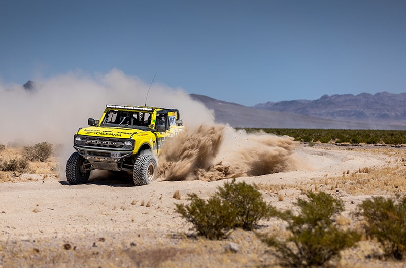 Yellow 4600 class bronco in the dirt