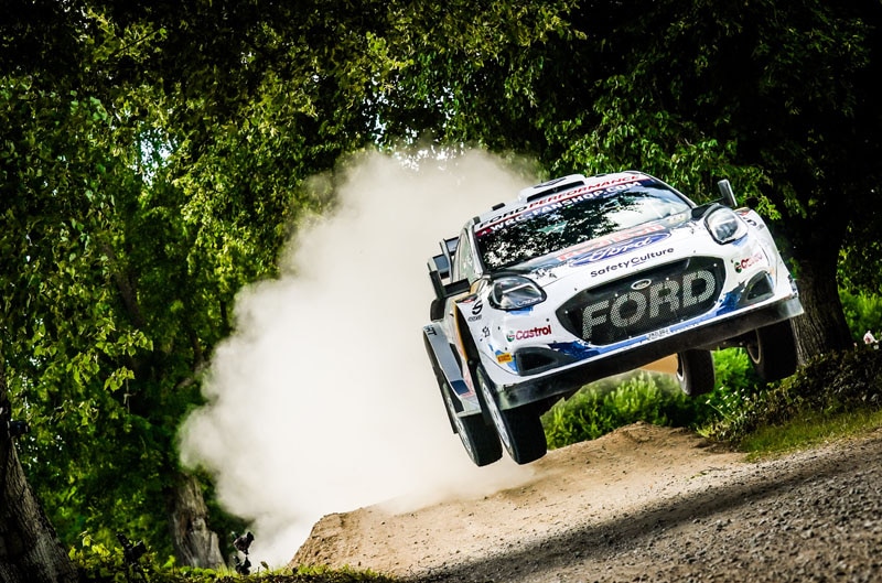 Puma Rally1 jumping on dirt path