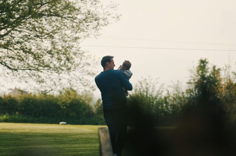 driver with baby walking